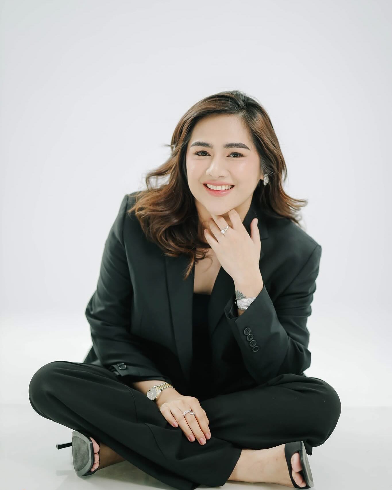 Dr. Nimeth Jann C. Tambut, aesthetic dermatologist, seated portrait